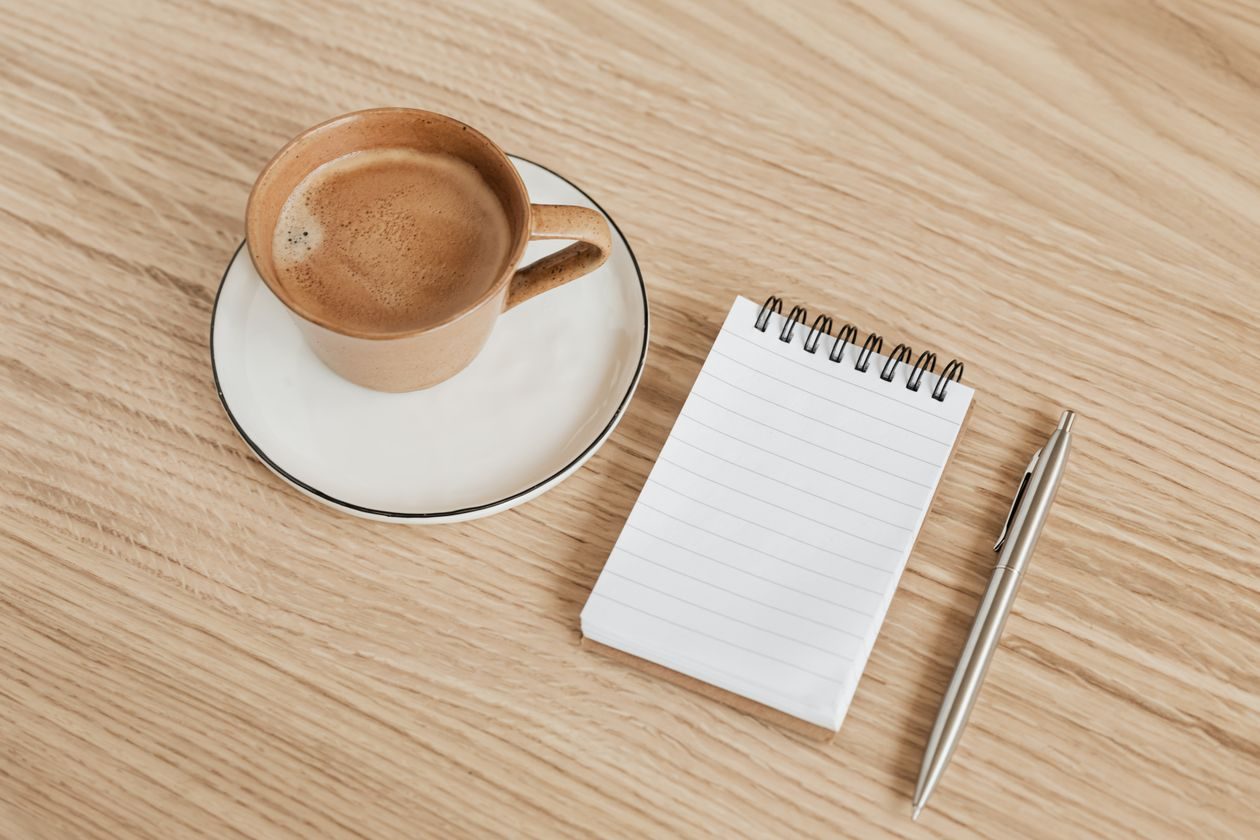 A fountain pen resting on handwritten notes
